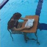guy studying in pool