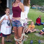 Tied to a pole with rope