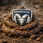 A dodge logo that is in a pile of poo