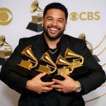 Holding a bunch of Grammys