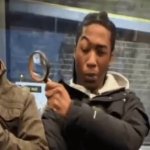 Black guy spyglass meme