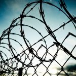 Barbe wire fence rolled razor wire concentration camp meme