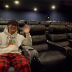 Man Sitting In A Movie Theahter Seat