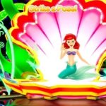 Who sits with ariel ?