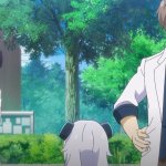 adults standing in front of child