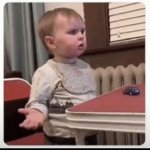 Baby Mad at Dinner Table