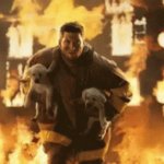 Firefighter carrying puppies