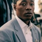 black suit guy staring