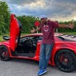 Man Near Expensive Car