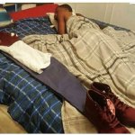 sleeping next to clothes