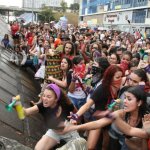 smiling man attacked by women