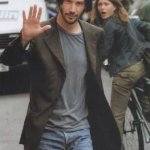 girl-riding-bike-looks-at-keanu-reeves