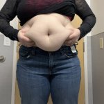 Lady grabbing fat blubber belly