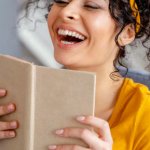 laughing woman reading