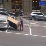 Man putting furniture in car