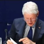 Bill Clinton Watching Old Photos