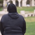 black lady walking away from mic