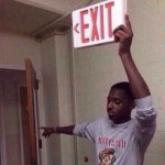 Guy holding exit sign