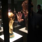 Neymar looking at trophy