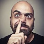 Man with Finger Up His Nose