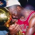 man holding trophy