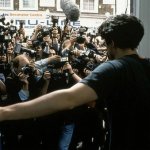 Dude surrounded by cameras