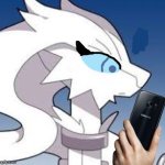 Verita the Reshiram looking at phone