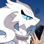Verita the Reshiram looking at phone annoyed