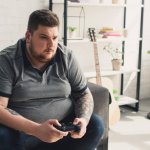 fat guy doing video games