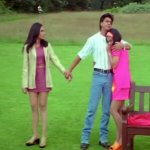 Shah Rukh hugging Kajol while holding one hand of Rani Mukerji