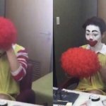 Clown taking off wig