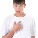 Boy pointing at himself