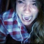 Girl crying with headphones
