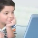 Kid watching his comupter