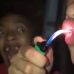 Man eating fire while friend is screaming