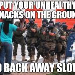 It looks like the First Lady got involved down in Ferguson, MO. . . | PUT YOUR UNHEALTHY SNACKS ON THE GROUND AND BACK AWAY SLOWLY | image tagged in us police,ferguson,healthy snack,first lady | made w/ Imgflip meme maker