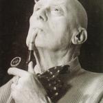Aleister Crowley smokes and contemplates