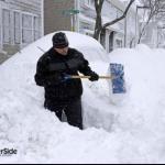 Realtor shoveling snow