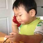 Asian Baby On Phone
