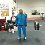 Old person deadlifting