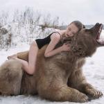 woman hugging a bear