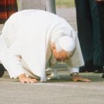 Pope kissing ground