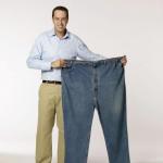 Subway Jarod holing his old big & tall jeans