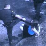 cop kicking woman