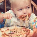 Baby eating spagetti