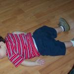 kid sleeping on floor