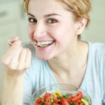 Happy Woman Eating Salad