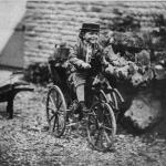 boy rides his horse bicycle around 1870
