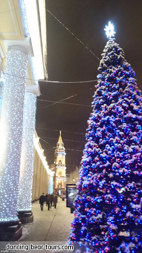 Witness the miracles of Christmas throughout St. Petersburg, especially in the Palace Square while snow flakes dance around you. | image tagged in tour,christmas | made w/ Imgflip meme maker