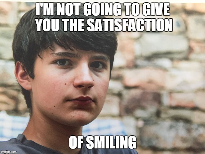 Marcus | I'M NOT GOING TO GIVE YOU THE SATISFACTION; OF SMILING | image tagged in marcus | made w/ Imgflip meme maker
